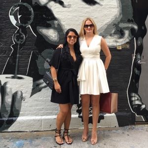 Alexander McQueen Black Wrap Dress & White Pleated V-Neck Dress